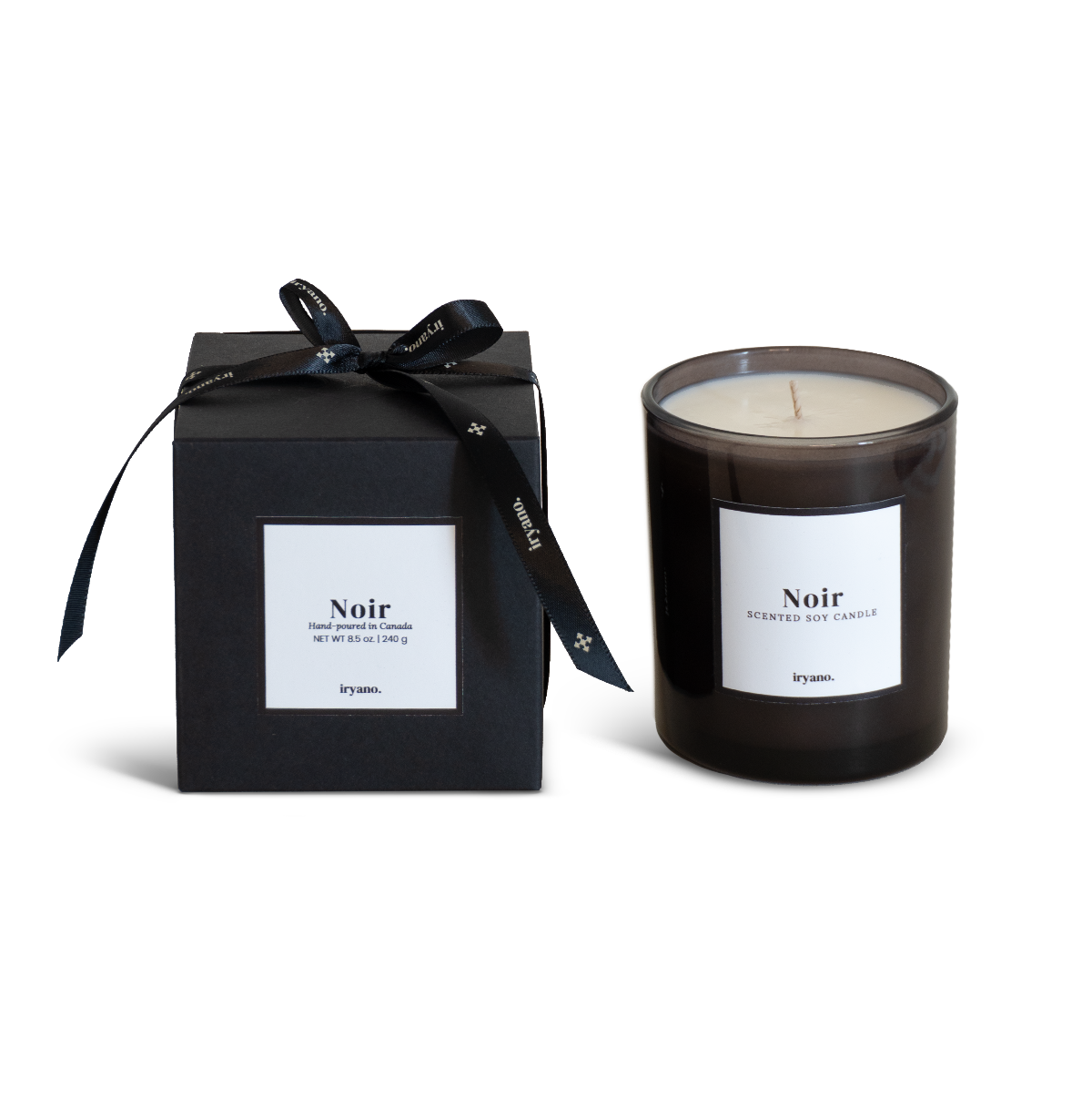 Black candle with 'Noir' label and matching black box on a white background