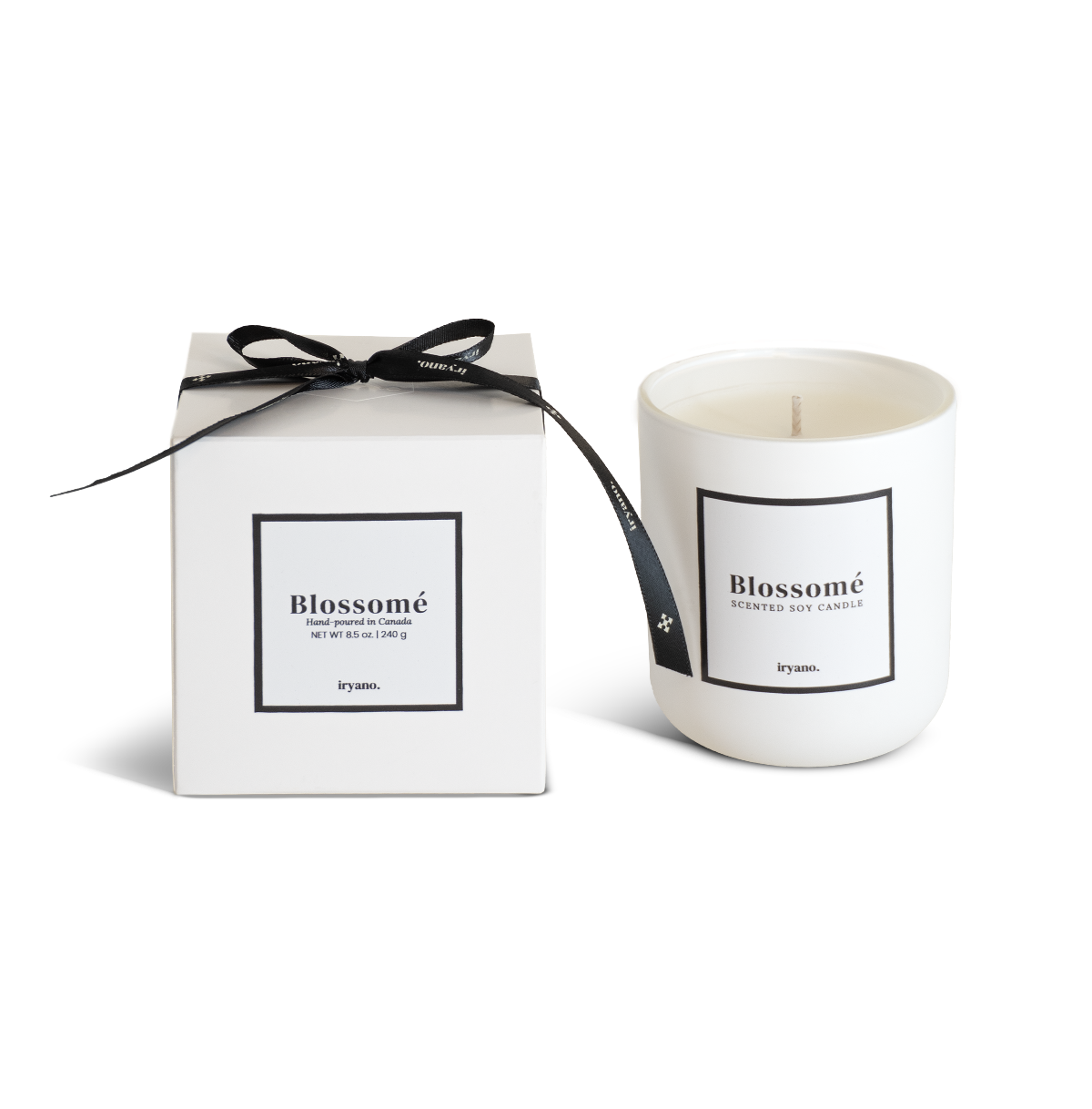 Candle with packaging labeled 'Blossomé' on a white background