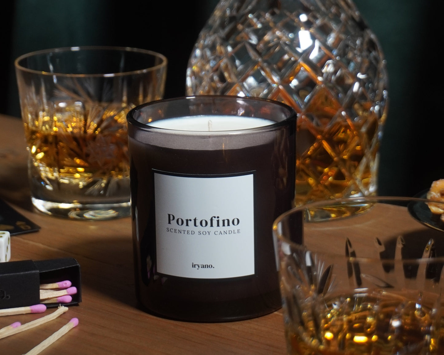 Bottle of Perrier-Joué with a decanter and glasses on a dark surface