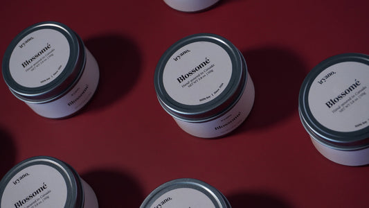 Multiple jars labeled 'Blossom' on a red background