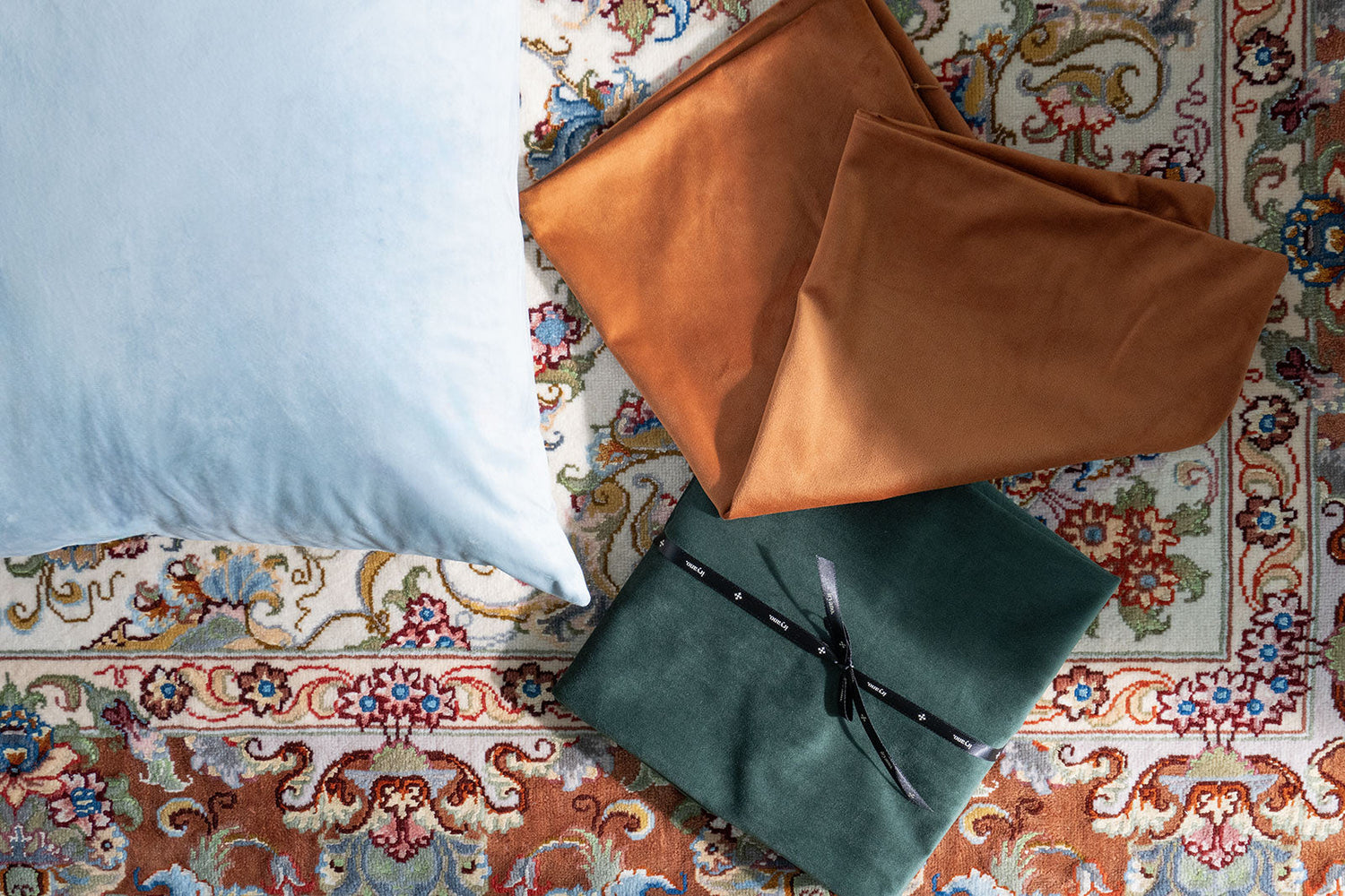 3 Velvet cushion covers, Light blue, orange, and dark green