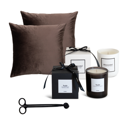 Brown pillows, candles, and boxes on a white background
