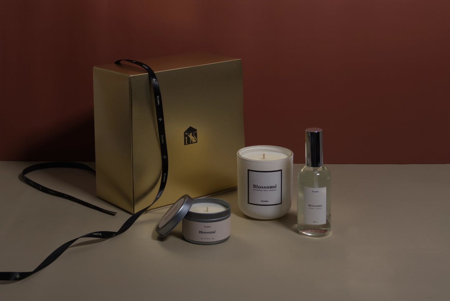 Set of candles and a bottle on a neutral background