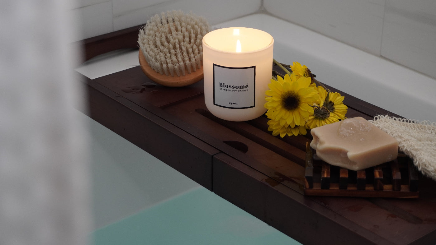 a white candle and some bath items