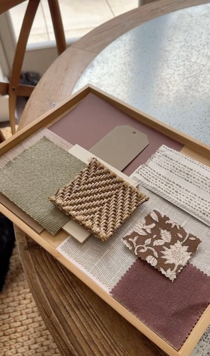 Color swatch book with fabric samples on a wooden table