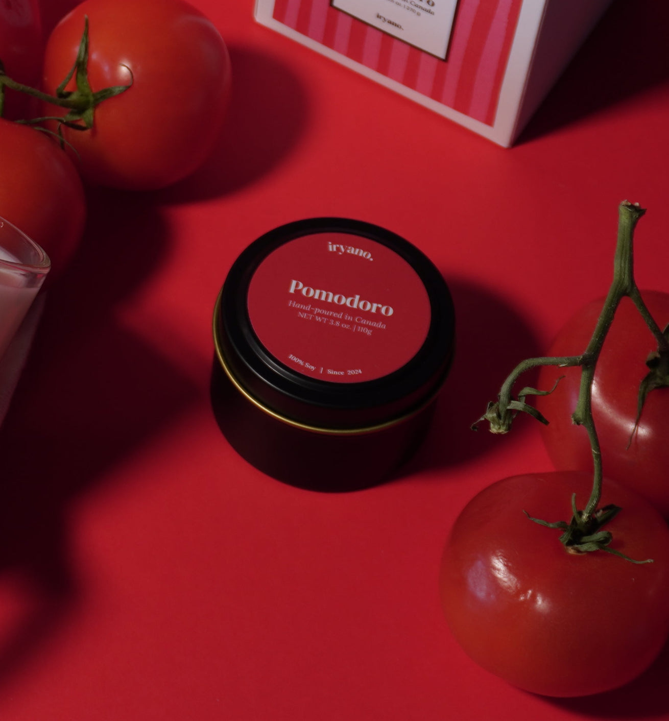 Cosmetic products and tomatoes on a red background