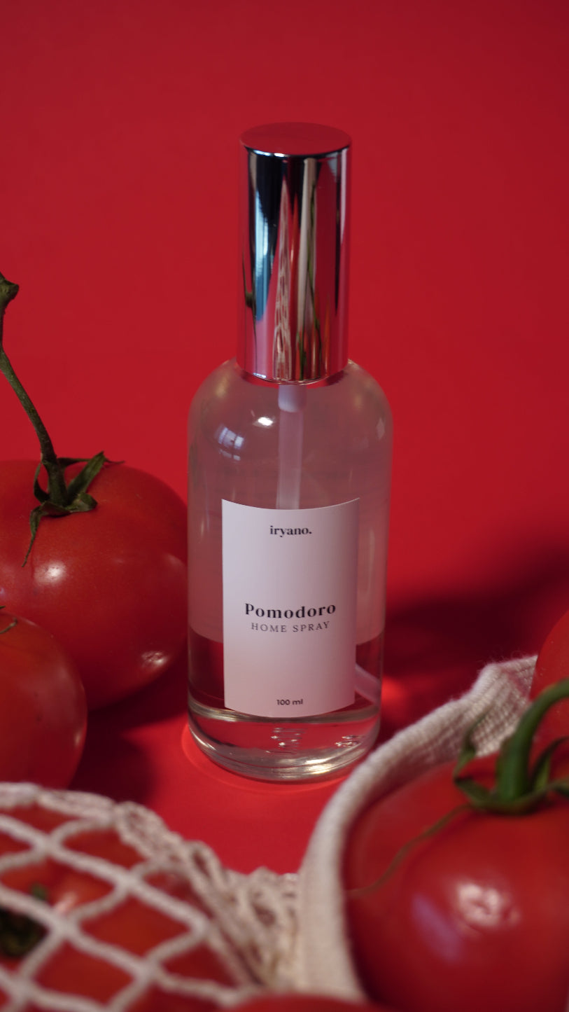 Bottle of perfume with a label on a red background