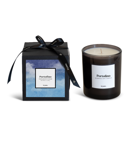 Black candle with 'Portofino' label and matching gift box on a white background