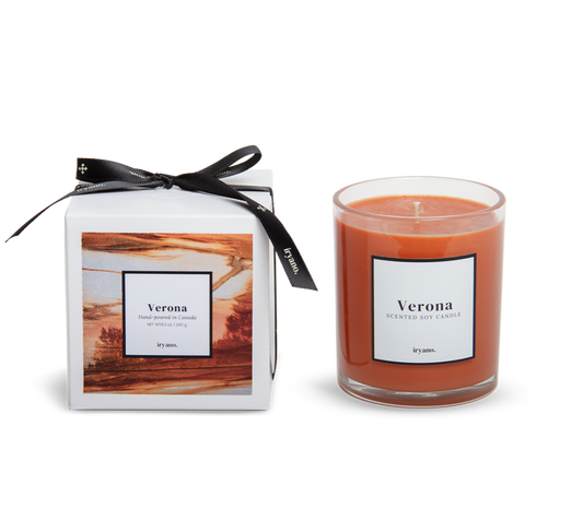 Candle labeled 'Verona' with packaging on a white background